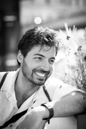 Smiling male model on a black and white photo